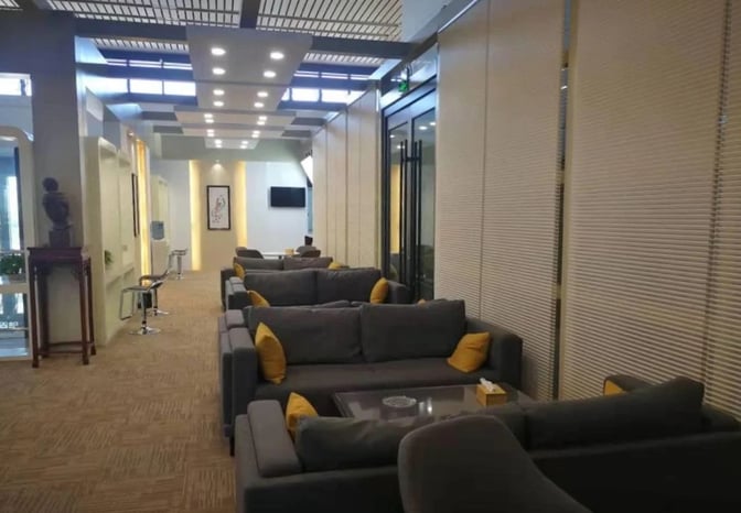 The seating area in First Class Lounge No.2 at Dunhuang Airport features comfortable sofas and small tables for passenger relaxation.
