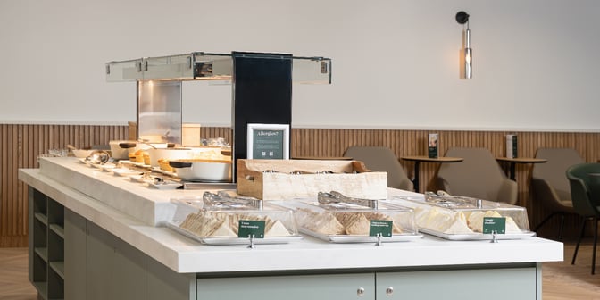 The Escape Lounge at East Midlands Airport features a self-serve food station with sandwiches and hot dishes available for guests.