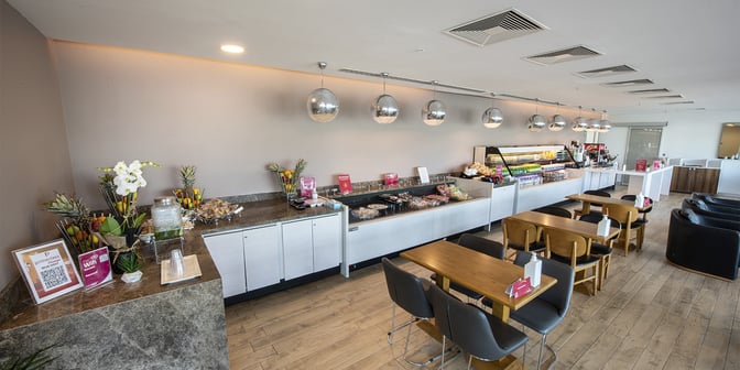 The Primeclass Lounge at Esenboğa International Airport features a self-serve food area with a variety of snacks and beverages.