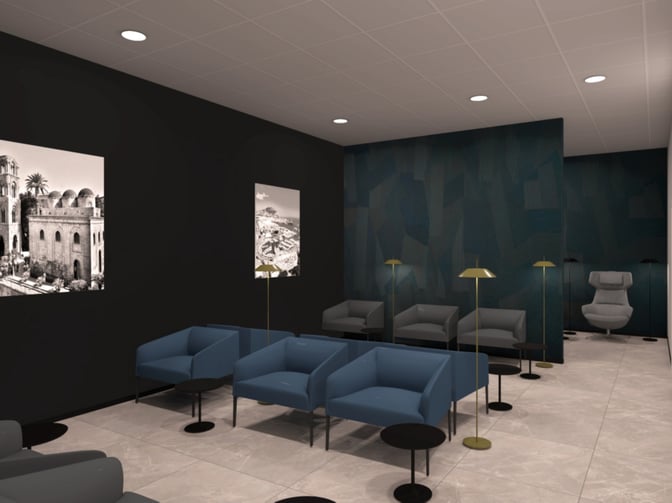 The Prima Vista Lounge at Falcone–Borsellino International Airport features seating areas with armchairs, side tables, and floor lamps for travelers.