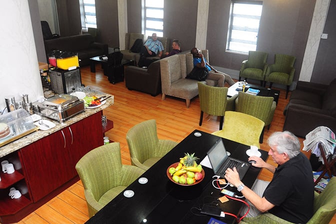 Nthula Lounge at Sir Seretse Khama International Airport features seating areas, a self-serve food station, and workspaces for travelers.