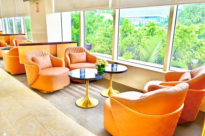 Comfortable seating in the Easy Travel Lounge 2 at Haikou Meilan International Airport offers views of the surrounding greenery.