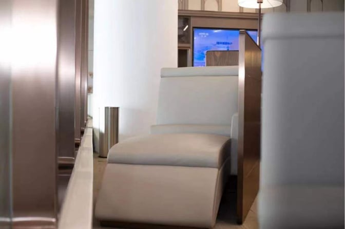 Reclining seating in Hainan Airlines Lounge at Haikou Meilan International Airport offers comfort and privacy for travelers.