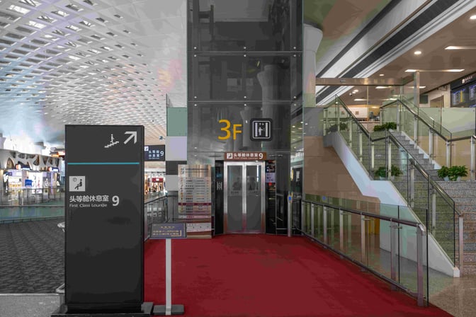 The entrance to the First Class Lounge at Hangzhou Xiaoshan International Airport is located on the third floor, accessible by stairs or elevator.