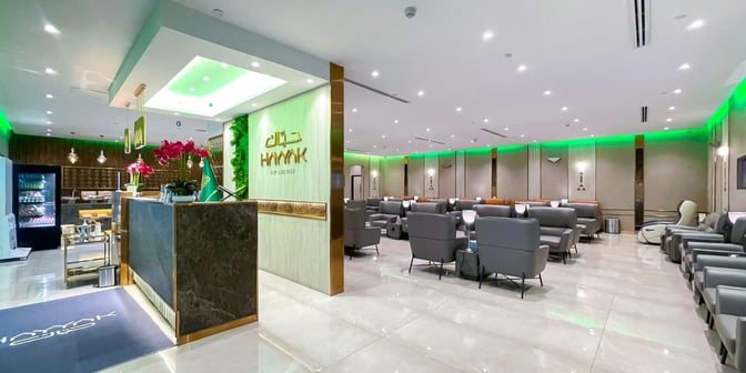 The Hayyak Lounge at Ta’if International Airport features a reception area with seating and a self-serve snack station.