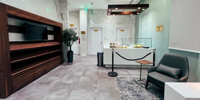 The Hayyak Lounge at Hail International Airport features a seating area with a display counter offering snacks and beverages.