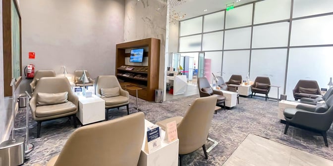 The Hayyak Lounge at Ta’if International Airport features comfortable seating with individual tables and a magazine rack for travelers.