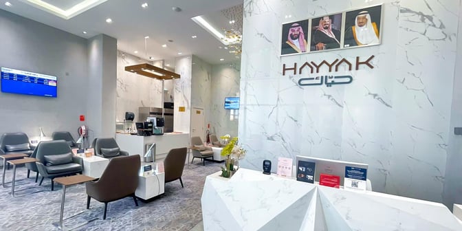 The Hayyak Lounge at Ta’if International Airport features comfortable seating with small tables and a service counter for refreshments.
