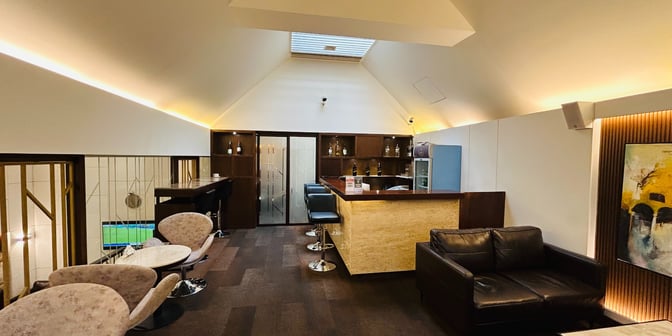 The UCB Imperial Lounge at Hazrat Shahjalal International Airport features a bar area with counter seating and a comfortable seating arrangement.