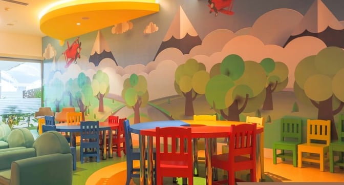 The IGA Lounge at Istanbul Airport features a Kids Zone with colorful seating and playful wall art for children's entertainment.