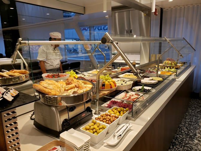 The Primeclass Lounge at JFK Airport features a self-serve buffet with a variety of breads, fruits, and cold dishes.