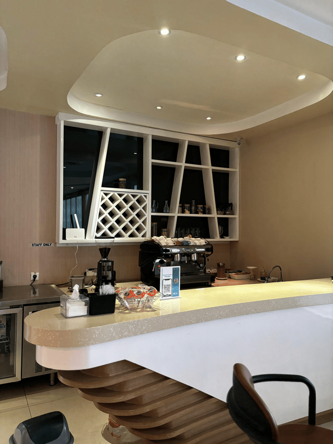 The Concordia Premier Lounge at Juanda International Airport features a coffee station with a counter, espresso machine, and seating.