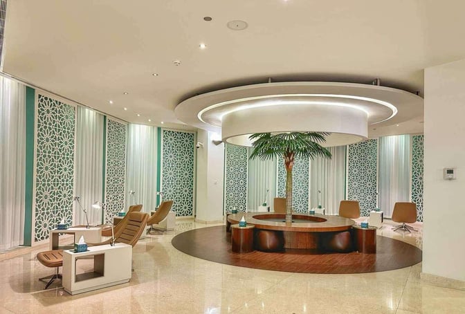 The Wellcome Lounge at King Fahd International Airport features a seating area with comfortable chairs and decorative privacy screens.