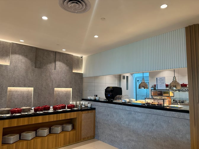 The food area in the Travel Club Lounge at Kota Kinabalu International Airport offers self-serve hot dishes and pastries.