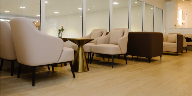 The seating area in The Pearl Exclusive Lounge at Krabi Airport features comfortable armchairs and small tables for passenger relaxation.