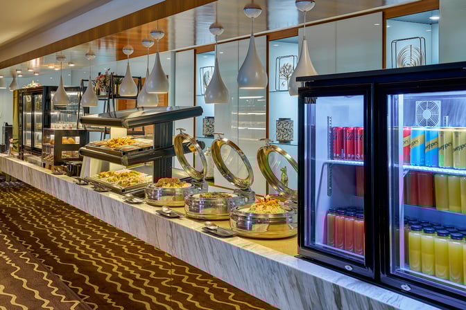 The Sky Suite Airport Lounge at Kuala Lumpur International Airport features a self-serve buffet with hot dishes and refrigerated beverages.