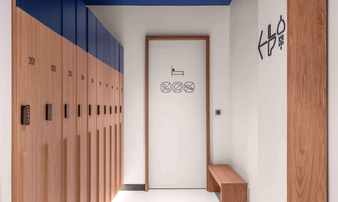 Lockers at Kepler Club in Kuala Lumpur International Airport offer secure storage with digital locks, adjacent to a bench for convenience.