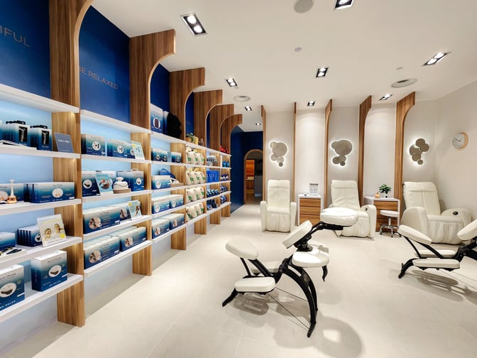 The Be Relax lounge at Kuala Lumpur International Airport features massage chairs and a retail area with wellness products.