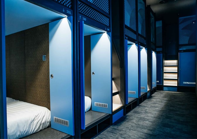 Sleeping pods at Capsule Transit KLIA 2 offer private resting spaces with individual lighting and ventilation, located airside at Kuala Lumpur International Airport.
