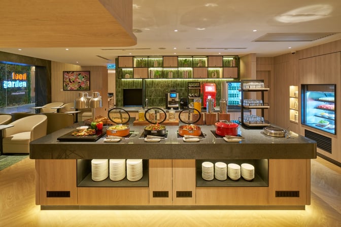 The Plaza Premium Lounge at Langkawi International Airport features a self-serve food station with hot dishes and beverages.