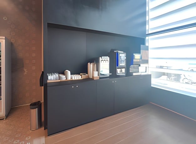 The ANA Airport Lounge at Lisbon Portela Airport features a self-serve beverage station with coffee machines and cups available for guests.