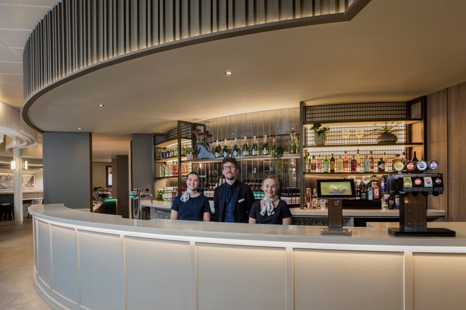 The Aspire Lounge bar at Liverpool John Lennon Airport offers a variety of beverages with staff ready to assist travelers.