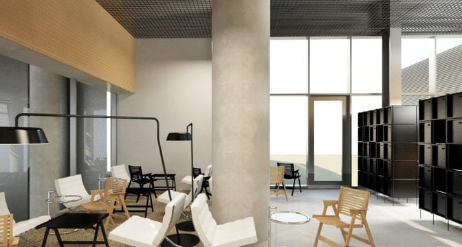 The Ljubljana Airport business lounge features a seating area with chairs and tables, offering a space for relaxation and work.