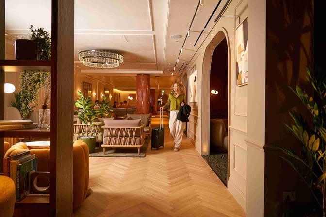 The No1 Lounge at London Heathrow Airport features comfortable seating areas with plants and decorative elements, providing a relaxing environment for travelers.