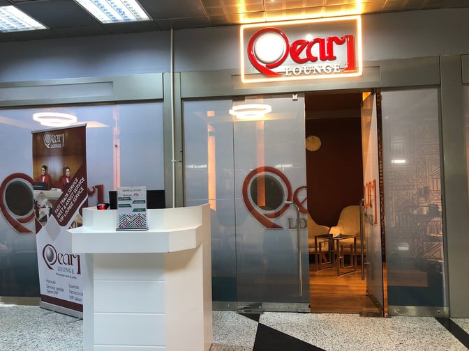 The entrance to Pearl Lounge at Luxor International Airport features a reception desk and visible seating area inside.