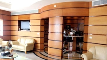 The Pearl Lounge at Marsa Alam International Airport features a seating area with sofas and a small bar for refreshments.