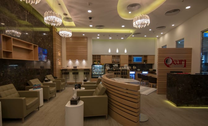 The Pearl Lounge at Marsa Alam International Airport features comfortable seating, a bar area, and a self-service food station.