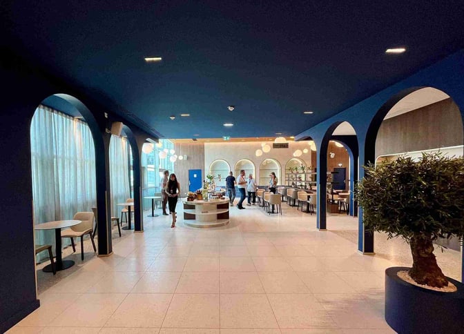 The VIP Lounge at Marseille Provence Airport features a seating area with tables and chairs, offering a comfortable space for travelers.