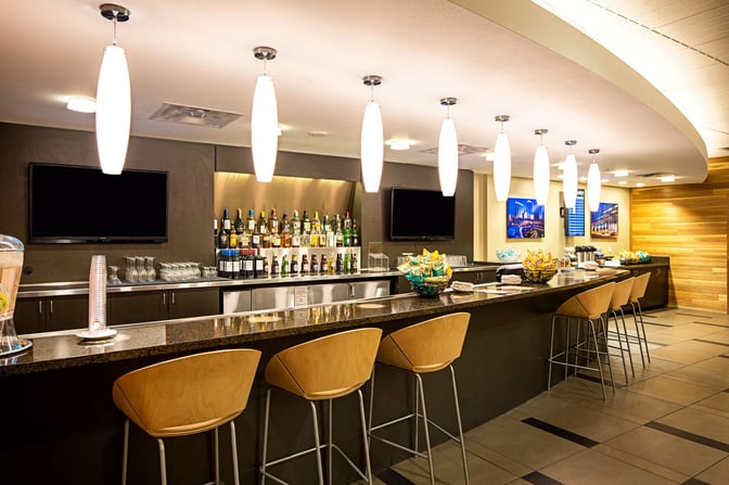 The Club LAS bar at McCarran International Airport offers a selection of spirits and snacks with counter seating available.