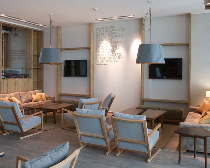 The Star Alliance Lounge in Buenos Aires features modern, comfortable seating with wooden accents...