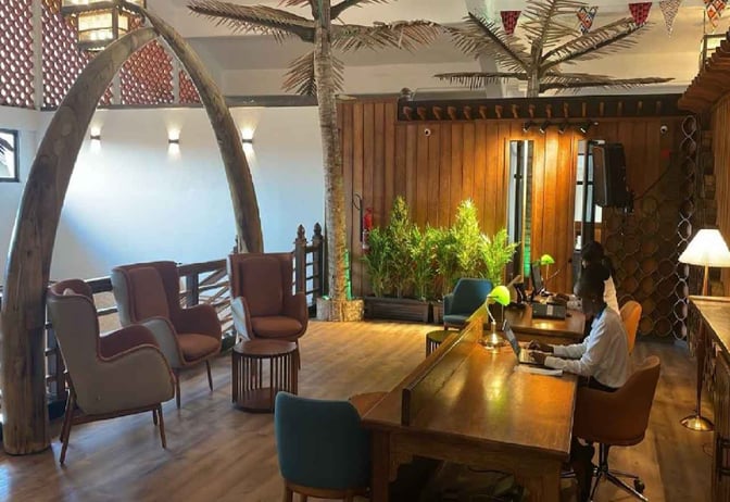 The Bosphorus Lounge at Moi International Airport features a seating area with armchairs and a staffed reception desk for guest assistance.