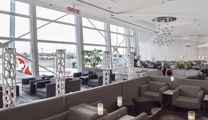 The seating area in the National Bank Lounge at Montreal-Trudeau International Airport offers comfortable chairs with views of the tarmac.