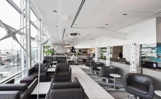 The seating area in the National Bank Lounge at Montreal-Trudeau International Airport offers comfortable chairs with views of the tarmac.