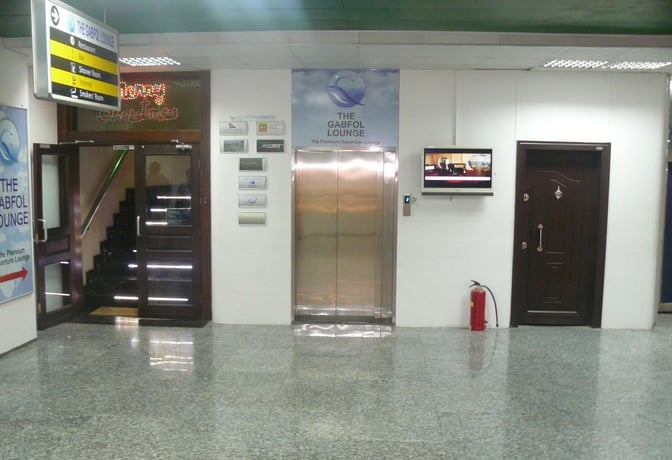 The entrance to The Gabfol Lounge at Murtala Muhammed International Airport features a staircase and elevator access for travelers.