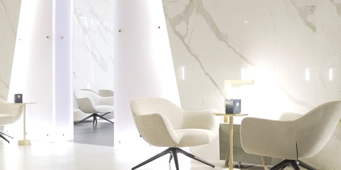 Comfortable seating in Majan Lounge at Muscat International Airport features armchairs and small tables, providing a relaxing space for travelers.