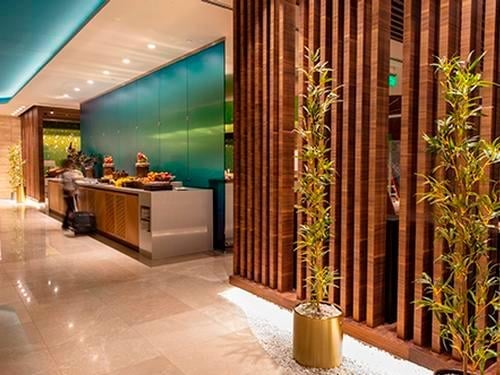 The Primeclass Lounge at Muscat International Airport features a buffet area with self-serve food options.