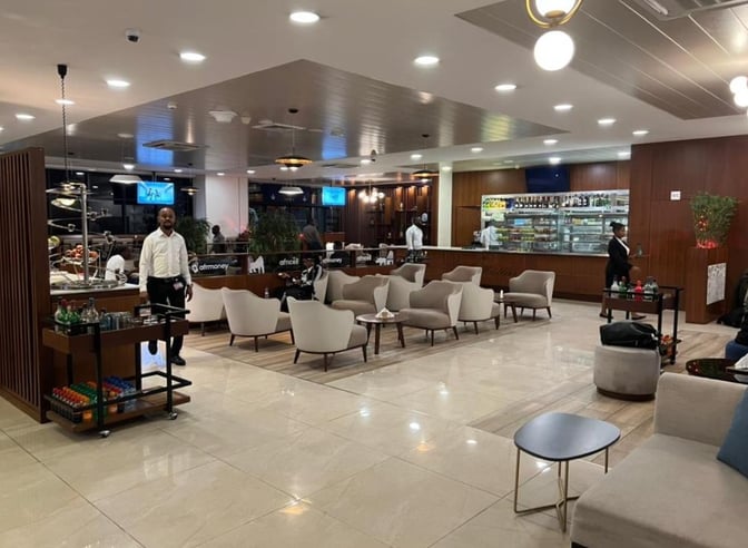 The Le Meilleur VIP Lounge at N'Djili International Airport features a seating area with armchairs and a bar offering refreshments.