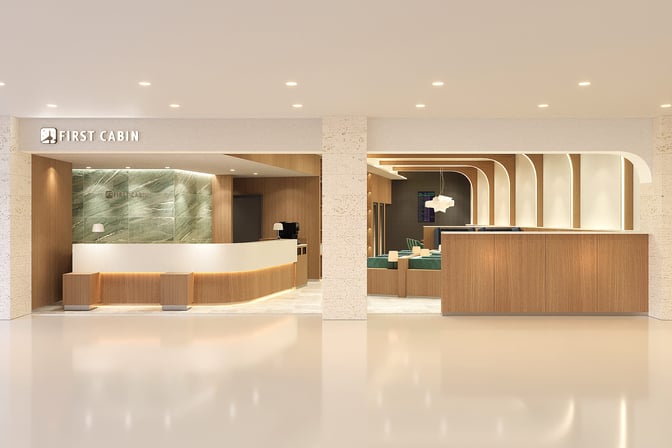 The entrance to First Cabin Naha Airport lounge features a reception desk and visible seating area for travelers.
