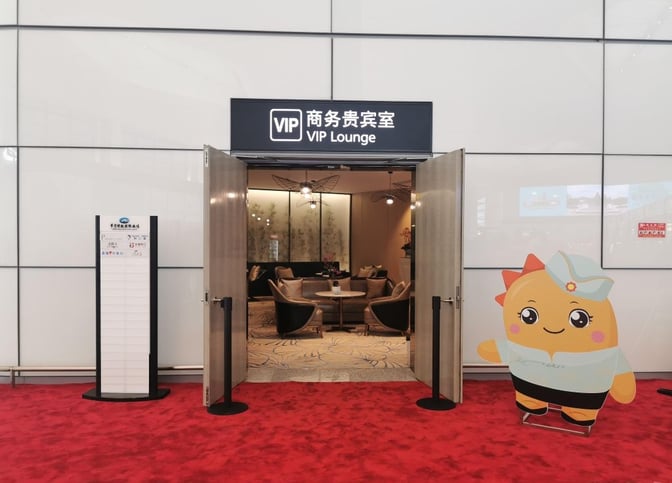 The VIP Lounge entrance at Ningbo Lishe International Airport features open doors revealing a seating area with chairs and tables.