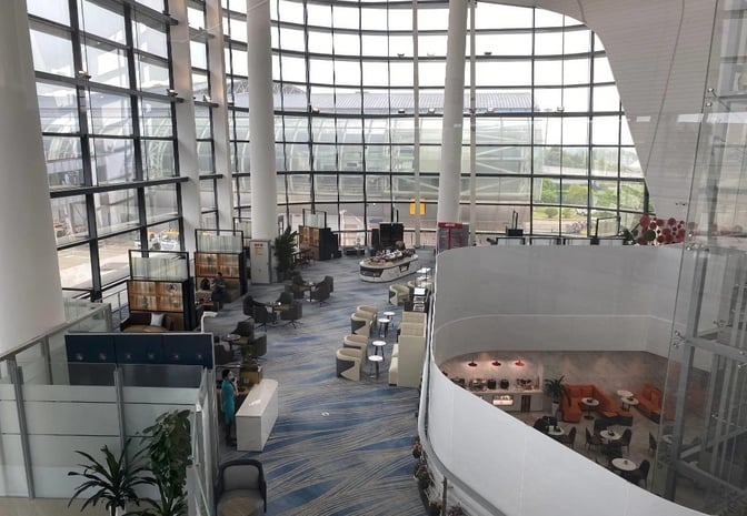 The YONGYI VIP Room at Ningbo Lishe International Airport features spacious seating areas with a central buffet and large windows.