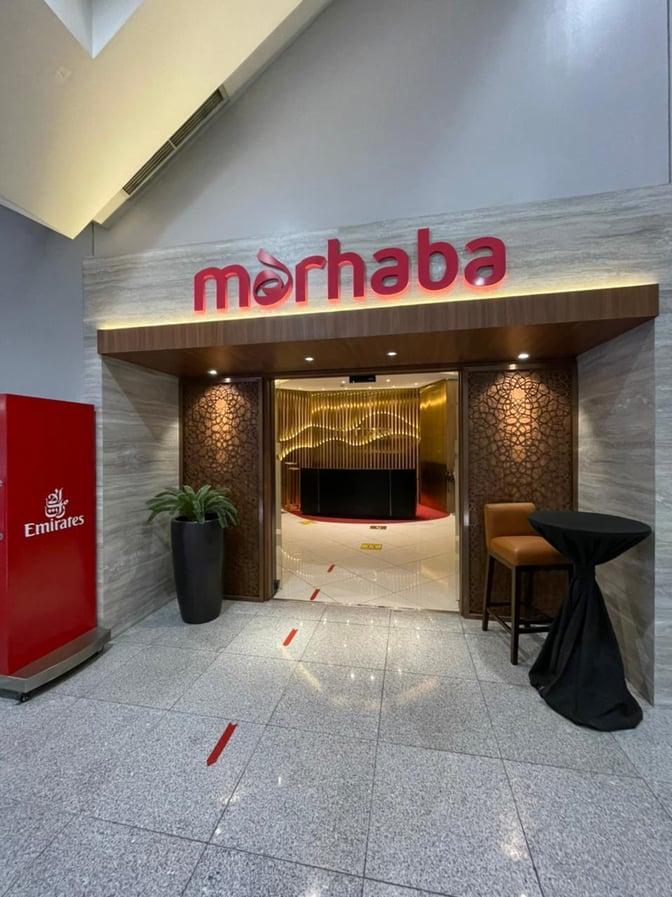 The entrance to the marhaba Lounge at Ninoy Aquino International Airport features a welcoming sign and a small seating area.
