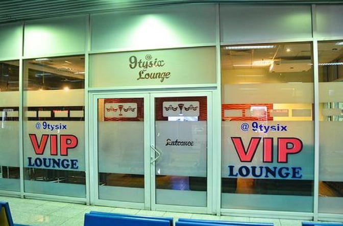 The entrance to the @9TYSIX VIP Lounge at Nnamdi Azikiwe International Airport features glass doors with signage indicating VIP access.