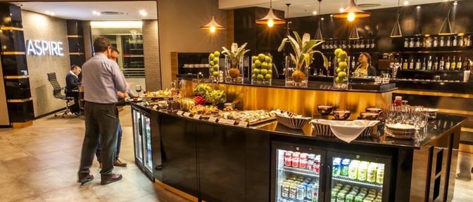 The Aspire Lounge at O. R. Tambo International Airport features a self-serve buffet with a variety of snacks and beverages.