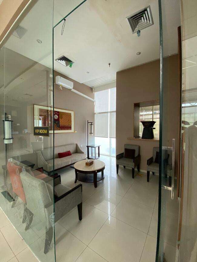 The VIP room at Saphire Lounge, Depati Amir Airport, features comfortable seating with a sofa and chairs around a central table.