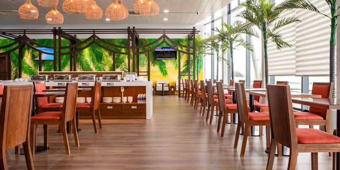 The SH Premium Lounge at Phu Cat Airport features a buffet area with chafing dishes and ample seating for travelers.