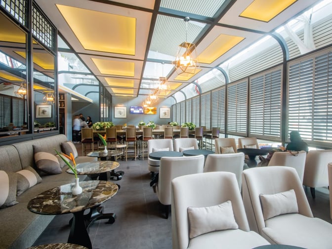 The Coral Executive Lounge at Phuket International Airport features comfortable seating and a bar area for travelers to relax.